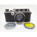 A Leica IIIb camera, serial number 242363, in outer leather case Provenance: Part of a vast single