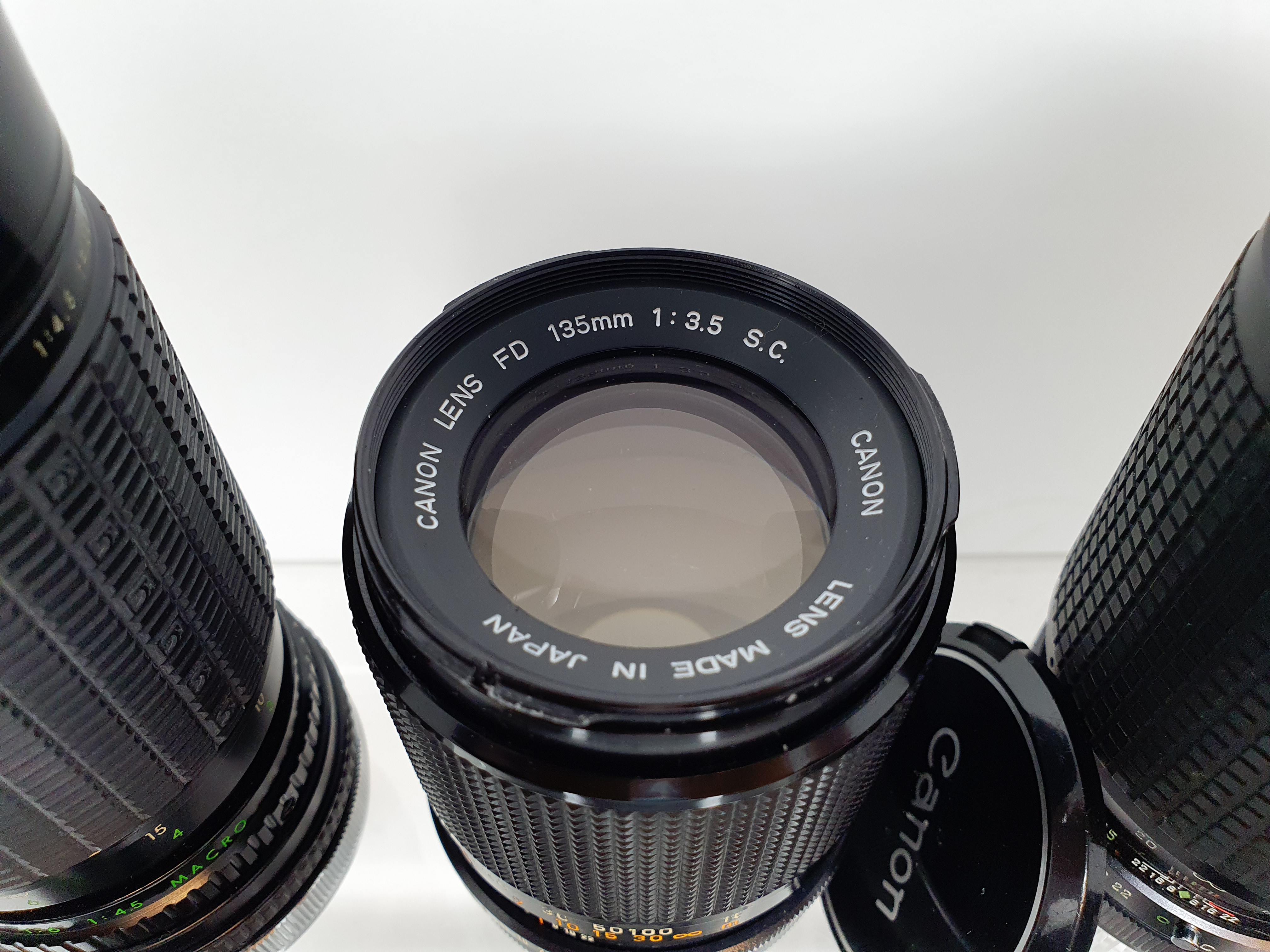 A Sigma camera lens, in outer case, another, three Canon lenses, and a Canon flash, in leather - Image 4 of 10