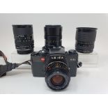 A Leitz Leica R4s camera, two Tamron lenses, a Leitz lens, other items, and a camera bag Provenance: