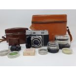 A Kodak Retina III, serial number 231293, in leather outer case, various accessories and lens, in