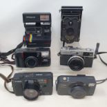 An Olympus 35 SP camera and various assorted photography items (qty)