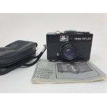 A Rollei 35 LED camera, with instructions, and outer case Provenance: Part of a vast single owner