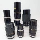 An Olympus camera lens, five other lenses, other items, and a camera bag Provenance: Part of a