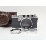 A Leica IIIf camera, serial number 566317, with leather outer case Provenance: Part of a vast single