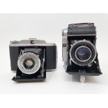 A Franka Solida III folding camera, and a G.B-Kershaw 110 folding camera (2) Provenance: Part of a