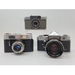 A Voigtlander Vitoret D camera, a Petri V Flex camera, and an Olympus-Pen camera (3) Provenance: