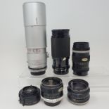 A Tamron camera lens, five other lenses, and a Minolta camera box (qty) Provenance: Part of a vast