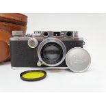 A Leica camera, serial number 120761, with leather outer case Provenance: Part of a vast single