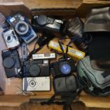 A Pentax 120 Mi camera, a Nikon L35 camera, an Olympus AZ-300, a Nikon L35, a Minolta Mark II