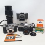 A Canon AE-1 camera, a Zeiss Ikon folding camera, a Kodak Retinette 1B camera and various assorted