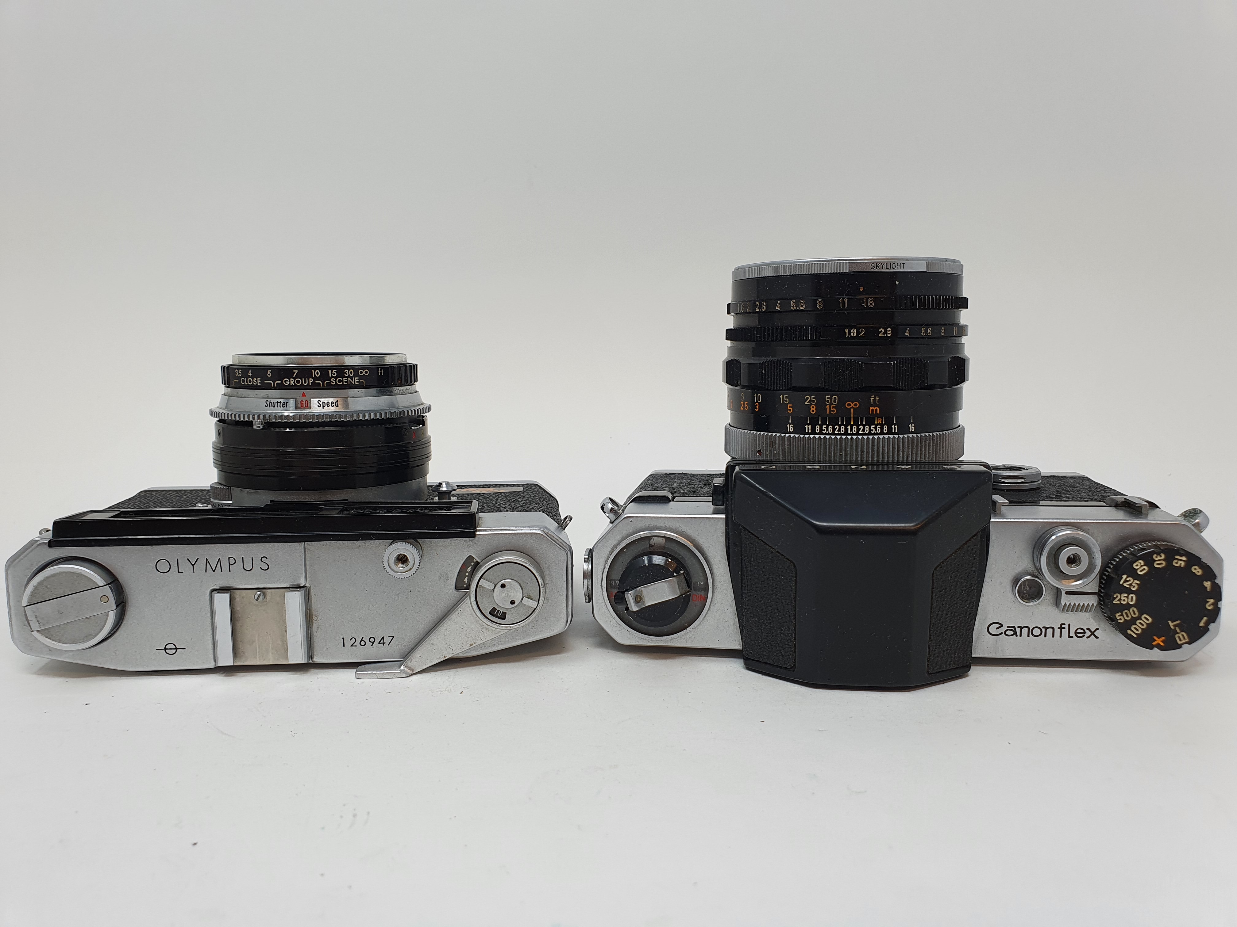 An Olympus camera, serial number 126947 and a Canon Canonflex camera (2) Provenance: Part of a - Image 3 of 4