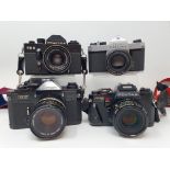 A Pentax Program A camera, Pentax SP 1000 camera, a Praktica EE 2, and a Canon EF camera (4)
