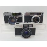 A Cosina compact 35S camera, a Yashica camera, serial number T-737513, and a Pretri 7 camera (3)