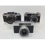 An Exakta VX 1000 camera, a Konica EE-Matic camera and a Yashica Minster III camera (3)