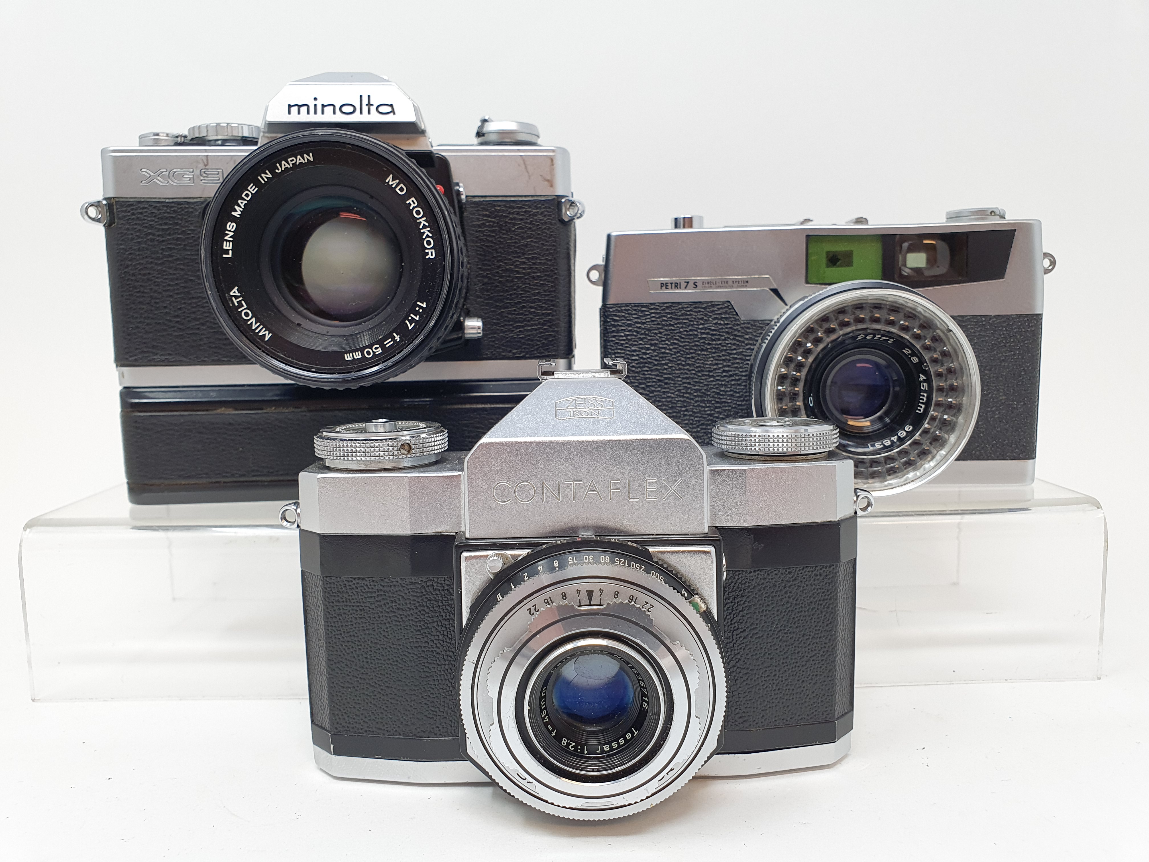 A Zeiss Ikon contaflex camera, a Minolta XG9 camera and a Petri 7S camera (3) Provenance: Part of