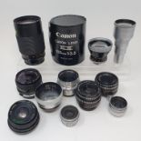 A Konica camera lens, and eleven other lenses (box) Provenance: Part of a vast single owner