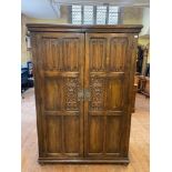 An 18th century style oak wardrobe, 128 cm wide