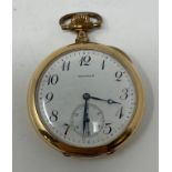 A Waltham open face pocket watch, in a gold plated case, monogrammed, and with a presentation
