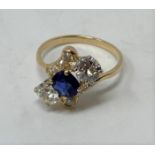 A sapphire and diamond three stone ring, ring size M 1/2