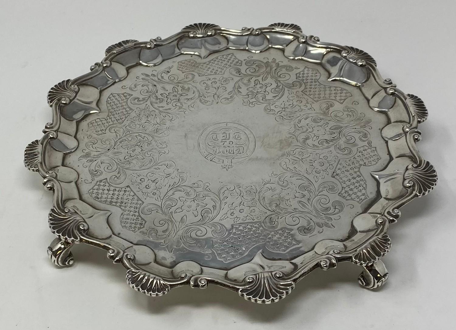 A late 18th century silver salver, later initialed within a garter, with a pie-crust edge, and