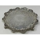 A late 18th century silver salver, later initialed within a garter, with a pie-crust edge, and
