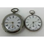 A silver open case pocket watch, and another similar