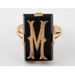 An 18ct yellow gold and onyx ring, initialled M, ring size Q