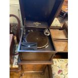 A Decca gramophone, in tall leather case, 29 cm wide, a Columbia gramophone in oak case, 40 cm wide,