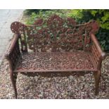 A Victorian style cast metal garden bench, 110 cm wide