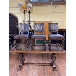 An 18th century style oak dining table, and four dining chairs (5)