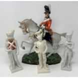 A Capo Di Monti figure, of a military officer on horseback, 33 cm high, and three other military