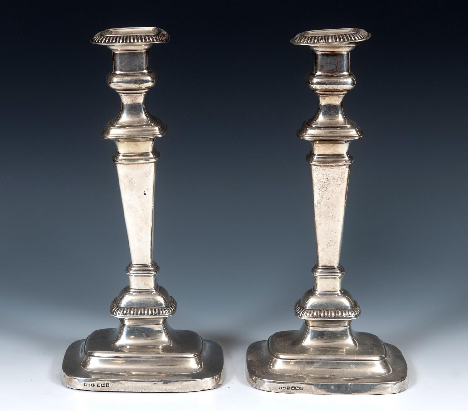 A pair of early 18th century style silver candlesticks, of rectangular form, Sheffield 1917, 31 cm