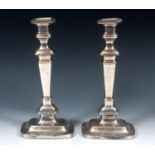 A pair of early 18th century style silver candlesticks, of rectangular form, Sheffield 1917, 31 cm
