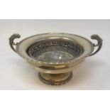 A silver pedestal bowl, inscribed, with dragon handles, Chester 1915, 16.5 ozt, 26 cm wide
