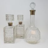 A pair of cut glassed decanters, with silver mounts, engraved, and various other decanters (box)