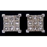 A pair of 18ct gold diamond princess cut checkerboard stud earrings Each earring containing nine