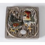 An unusual silver and enamel desk weight, decorated a cockerel, chicken and an egg, 8 cm wide