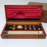 An early 20th century hydrometer, in a mahogany and ivory inlaid case, 25 cm wide, a 19th century