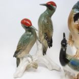 A Continental porcelain group, of two woodpeckers and various other similar figures (qty)