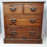 An oak chest, having two short and two long drawers, of small proportion, 48 cm wide