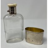 A glass flask, with silver and ivory mounts, initialed, with detachable cup, London 1930