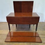 A 19th century mahogany dining table, with concertina action, on turned tapering legs to casters,
