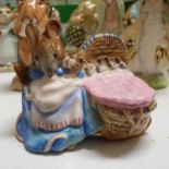 A Beswick Beatrix Potter figure, Hunca Munca, thirteen other Beatrix Potter figures, and ten boxes