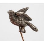 A stickpin, with a silver coloured metal bird surmount