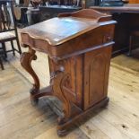 A 19th century walnut davenport, 56 cm wide