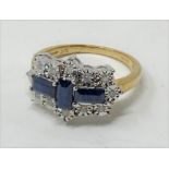 A 9ct gold, three baguette sapphire and twelve stone diamond ring Modern