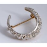 A diamond crescent brooch