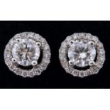 A pair of 18ct gold halo set diamond stud earrings Diamonds 0.36ct total weight approx. colour /
