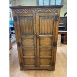 An 18th century style oak wardrobe, 110 cm wide