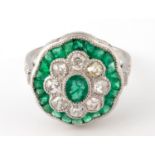 A platinum, emerald and diamond daisy style ring size L old cut diamond approx 0.95ct emeralds